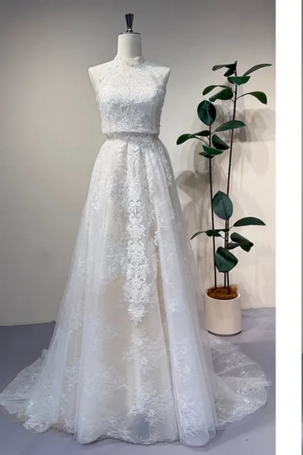 Convertible lace wedding dress with detachable high neck overlay and A-line skirt, elegant 2-in-1 bridal gown front view