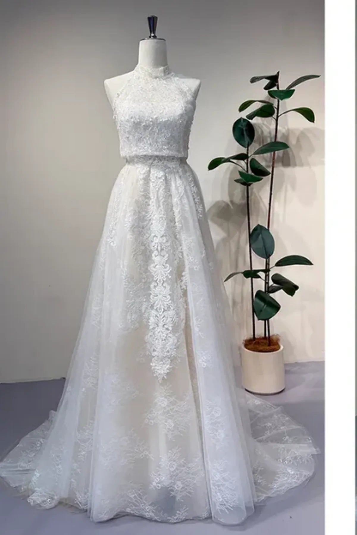 Convertible lace wedding dress with detachable high neck overlay and A-line skirt, elegant 2-in-1 bridal gown front view