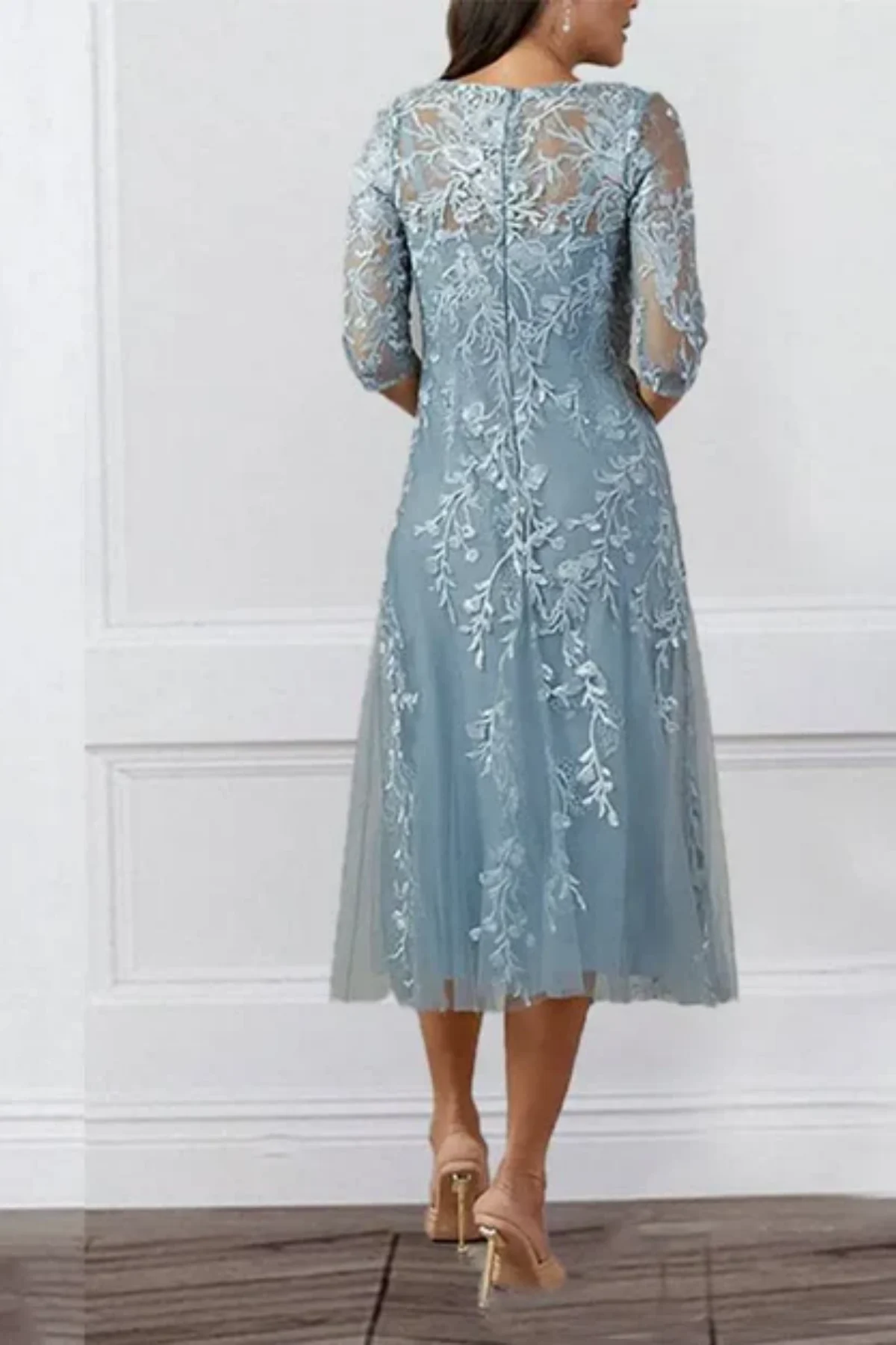 Back view of blue lace mother of the bride dress with sheer sleeves and zipper closure