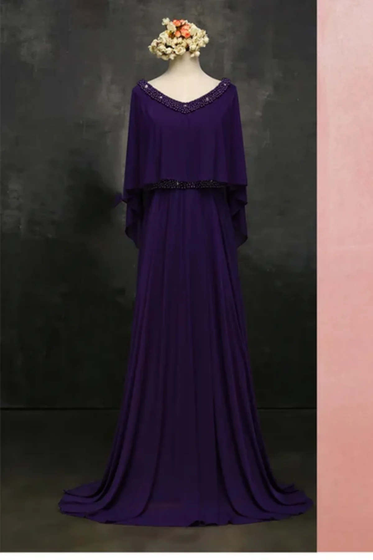 Front view of elegant navy mother of the bride dress featuring beaded neckline, sheer cape sleeves, and flattering A-line silhouette