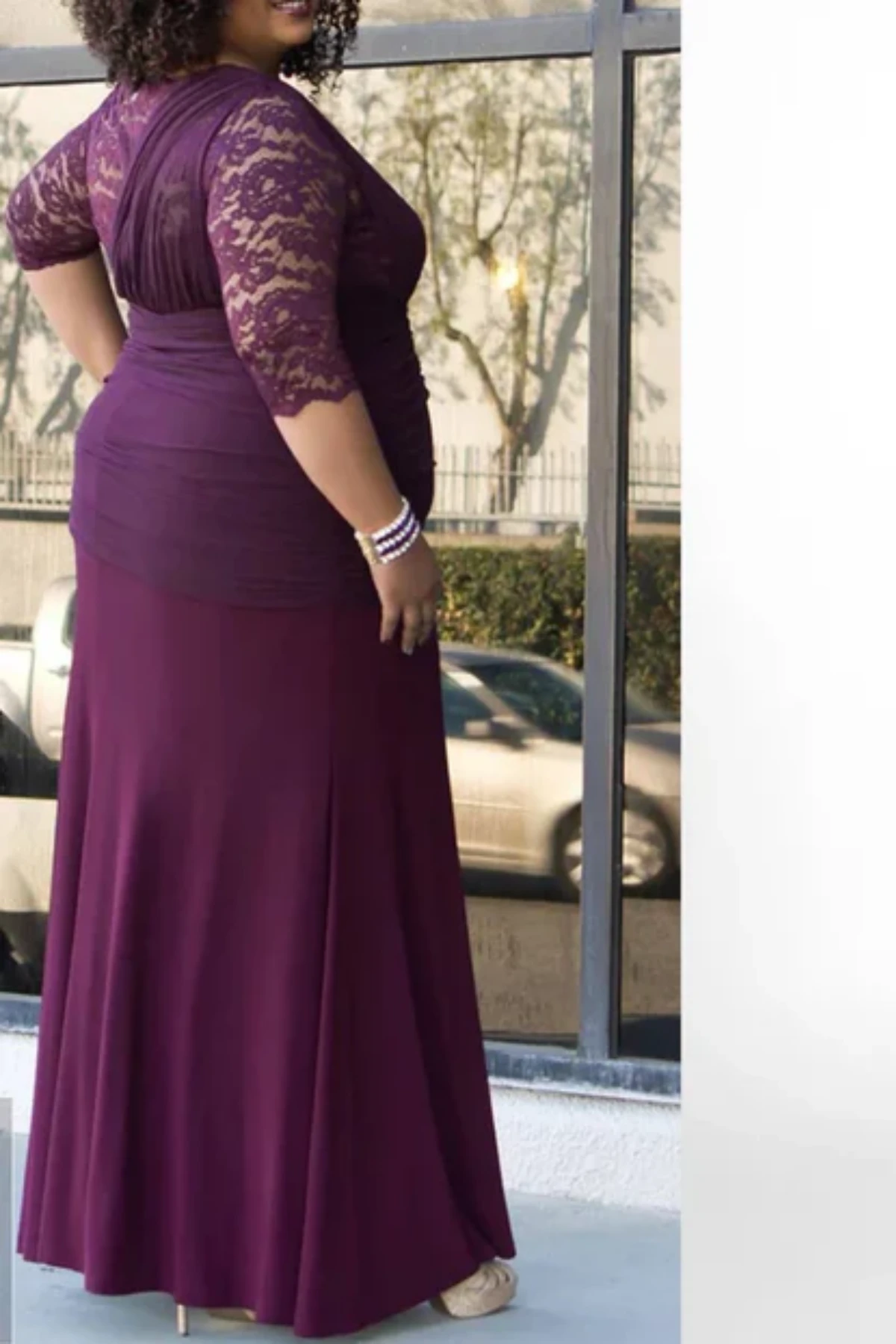 Plum mother of the bride gown with lace sleeves, draped chiffon bodice, and floor-length skirt, perfect for formal wedding