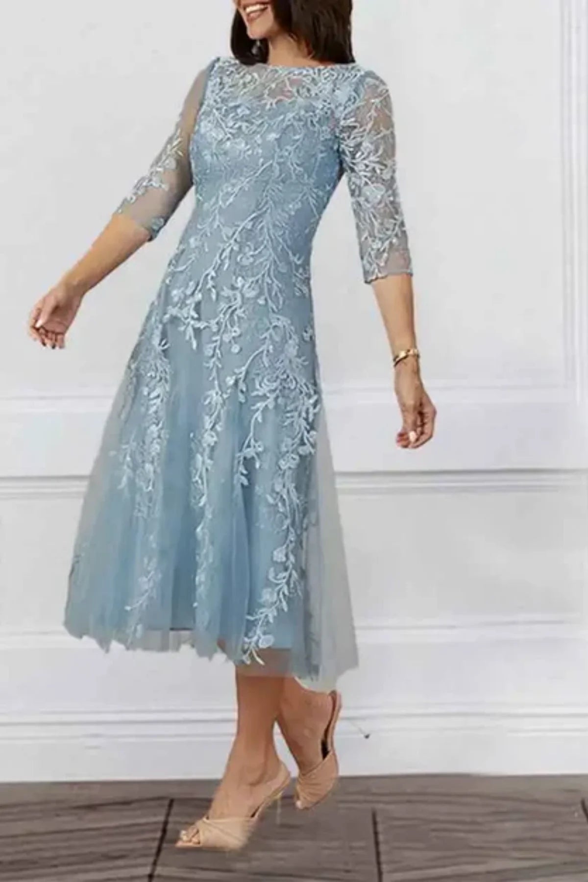 Side view of embroidered lace A-line mother of the bride dress in soft blue