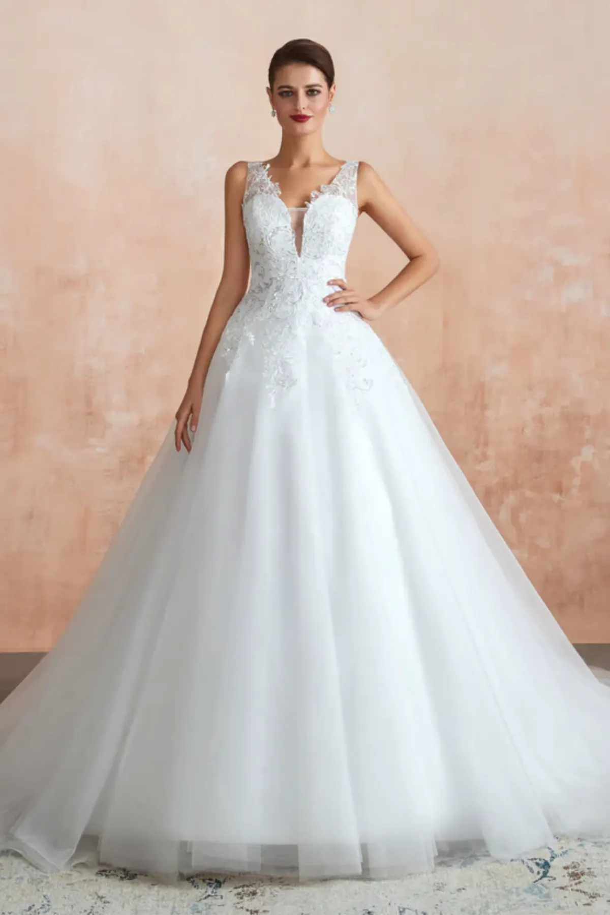 A-line lace tulle wedding dress with deep V neckline, sleeveless straps and flowing skirt front view