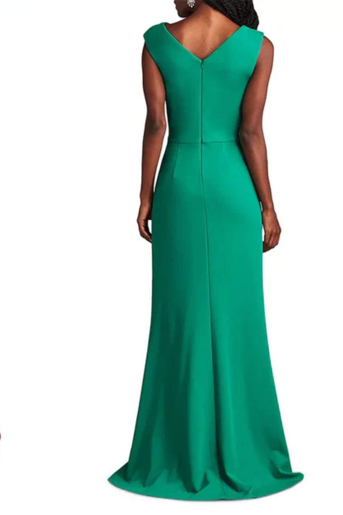 Back close-up of a green chiffin formal dress on a model, highlighting the clean, modern diagonal cut of the asymmetric back neckline