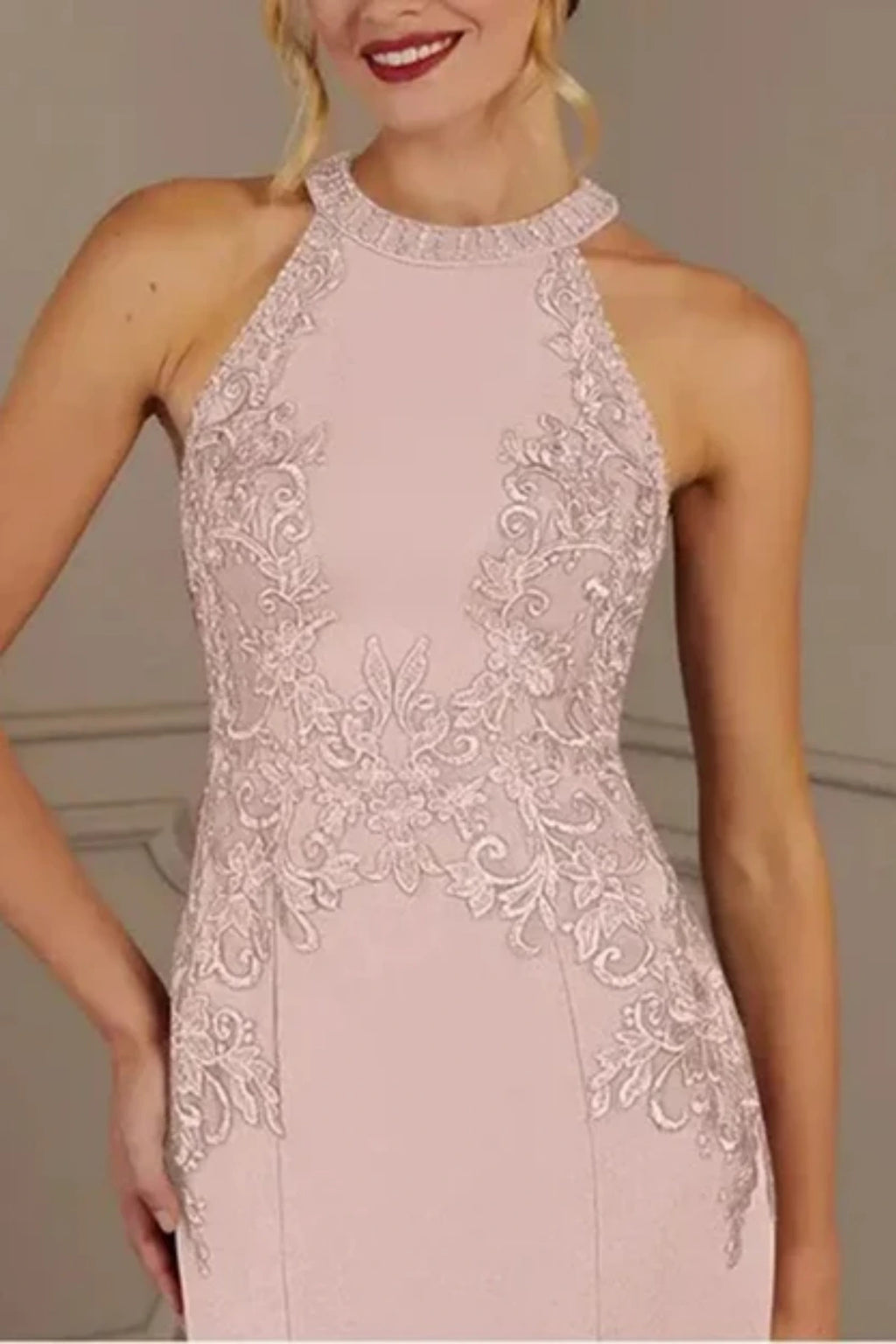 Glamorous silver embellishments and intricate embroidery details on a pink formal wedding guest dress