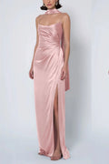 a dusty blush pink satin bridesmaid dress with a cowl neck, draped waist, matching neck scarf, and high leg slit