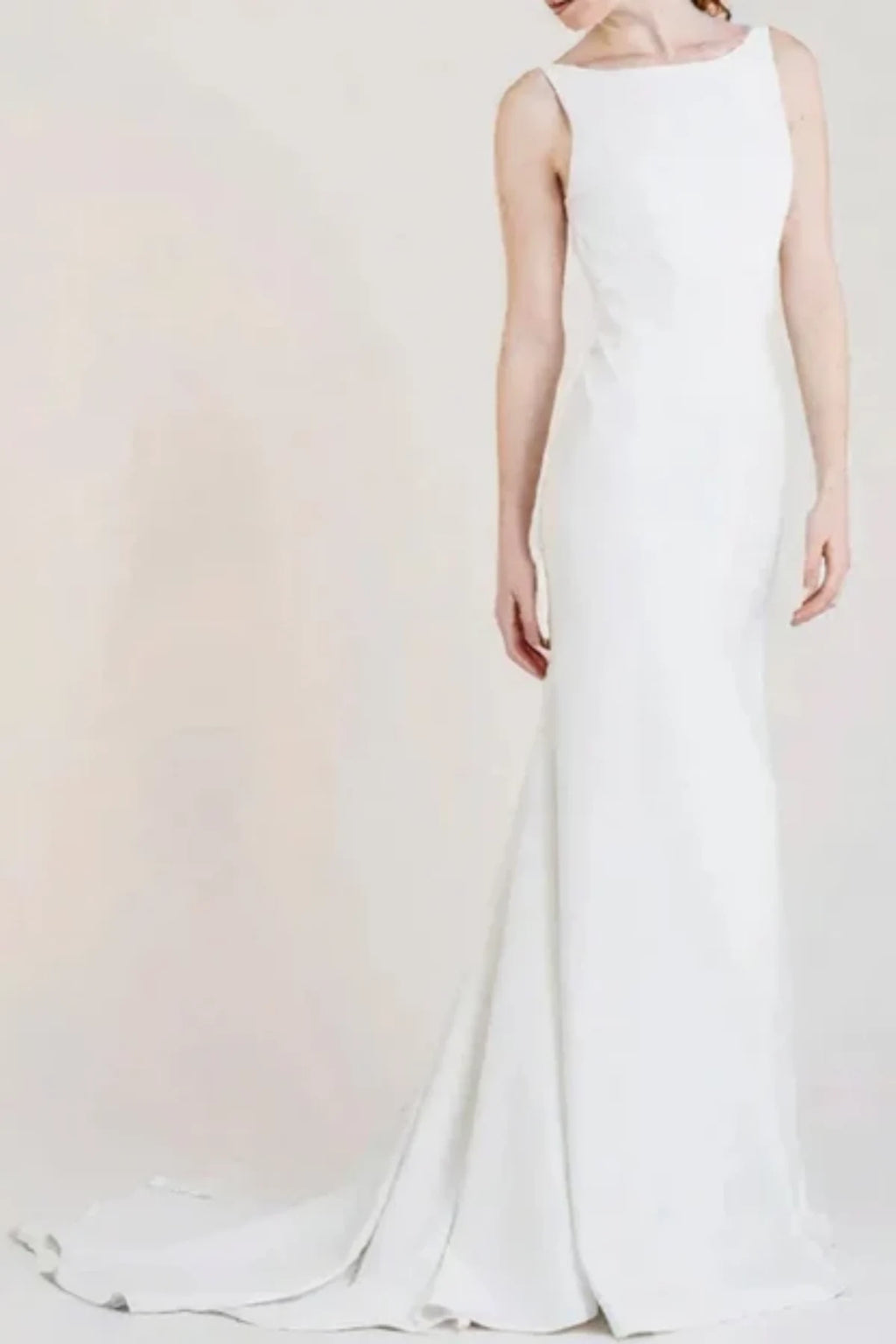 Minimalist boat neck wedding dress with sleek fitted silhouette