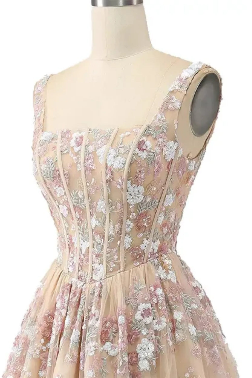close up top bodice details of champagne prom dress