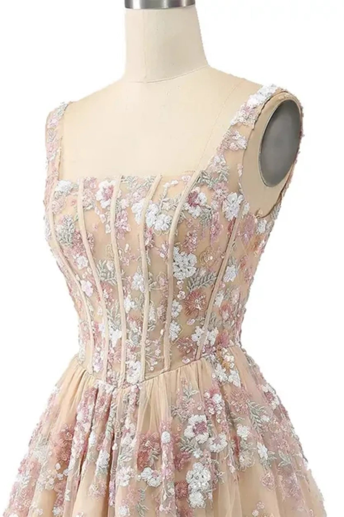 close up top bodice details of champagne prom dress