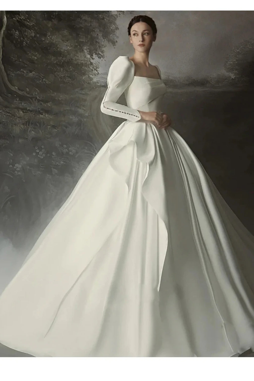 Classic satin ball gown wedding dress with long puff sleeves and full flowing skirt front view