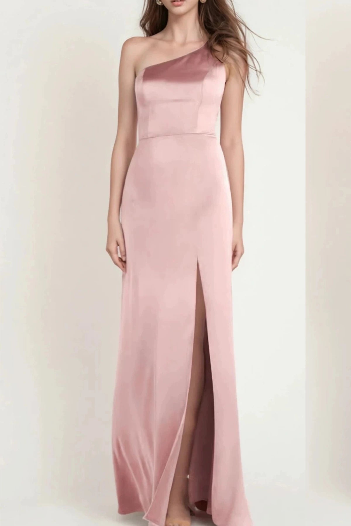 Dusty rose pink satin one-shoulder bridesmaid dress with floor-length skirt and front slit