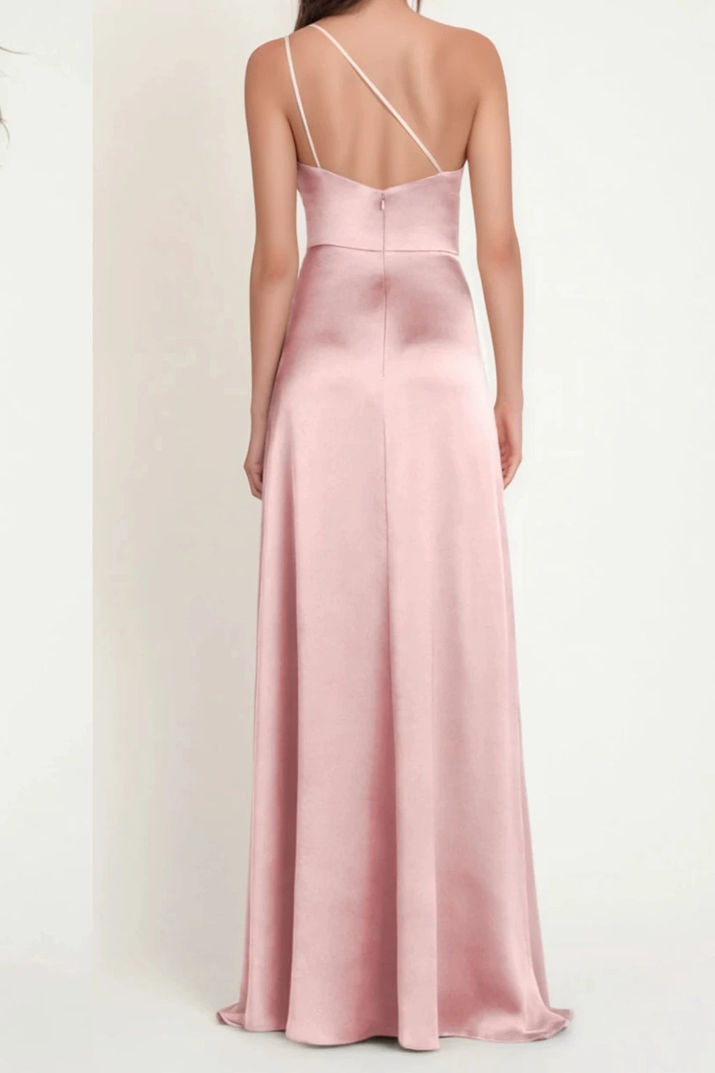Back view of dusty rose satin bridesmaid dress with delicate asymmetric straps and flowing skirt