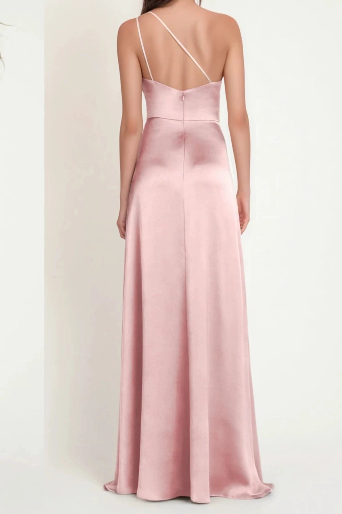 Back view of dusty rose satin bridesmaid dress with delicate asymmetric straps and flowing skirt
