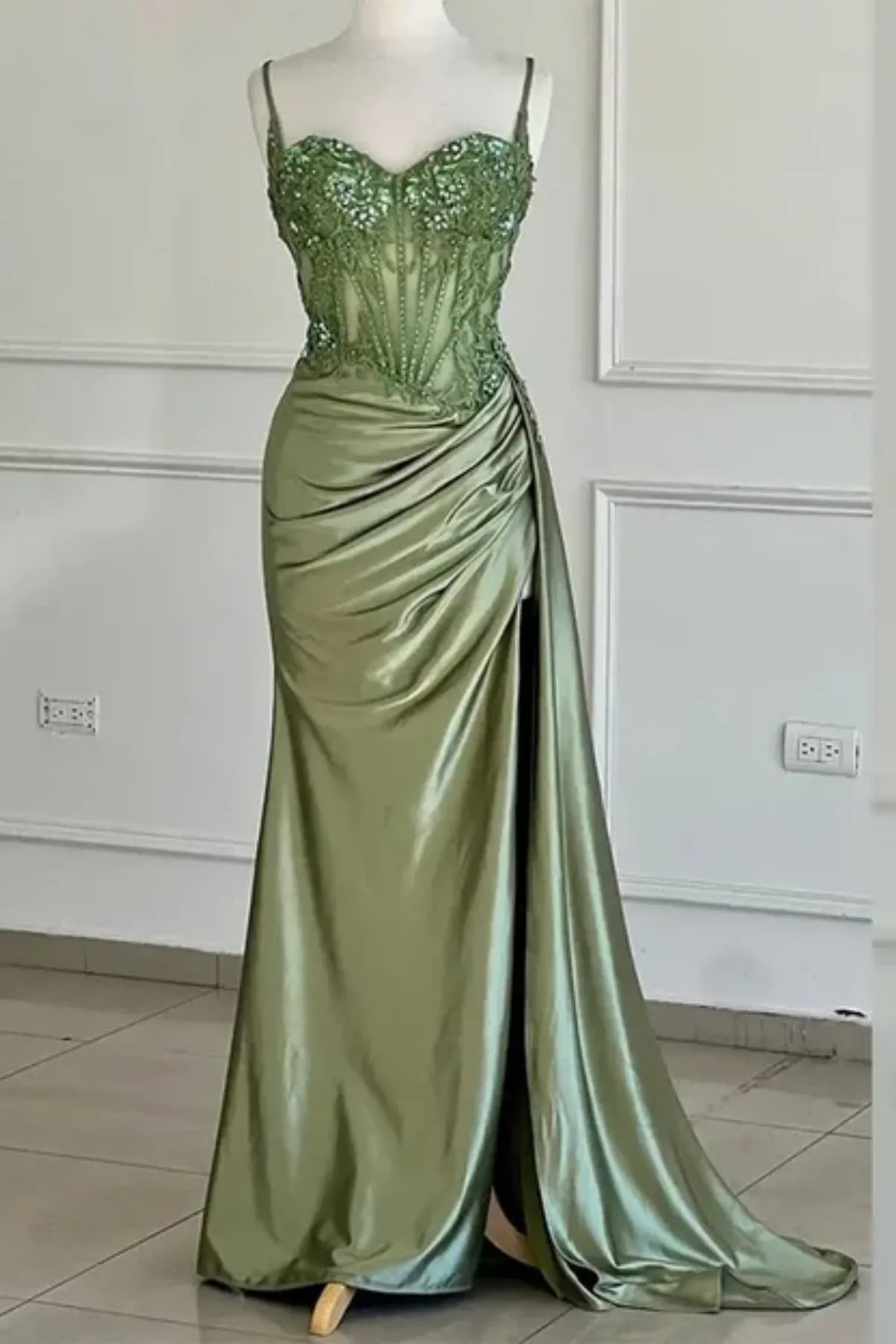 dusty green satin corset prom dress with ruched skirt