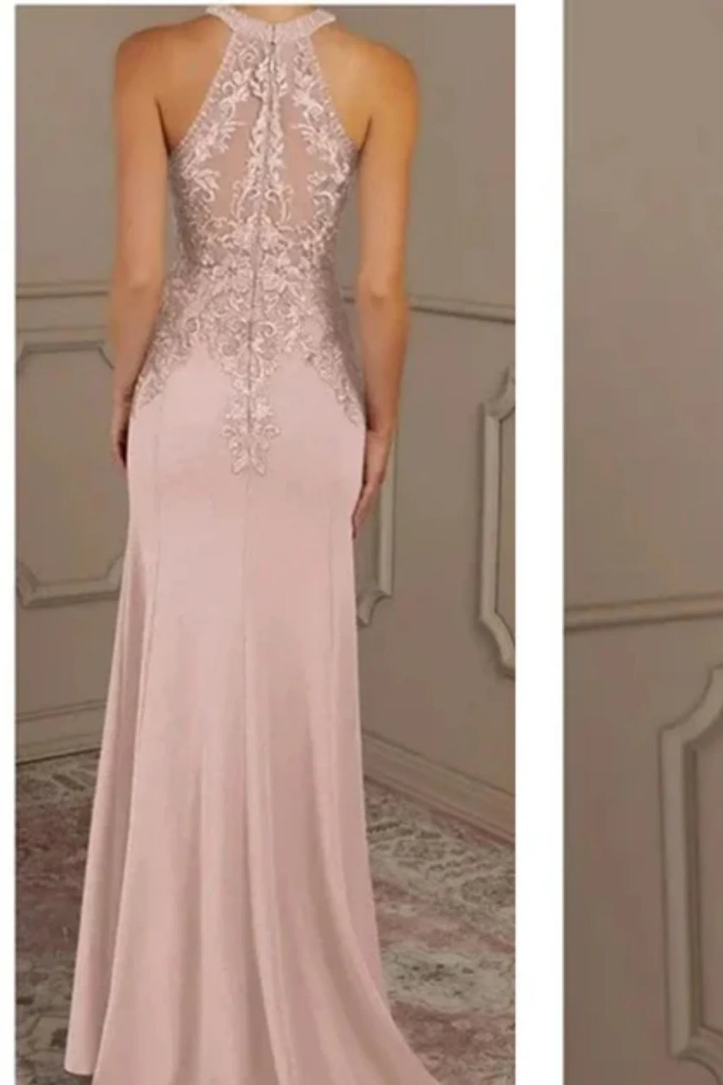 Full back view of a dusty pink mermaid formal gown displaying a sheer illusion back with lace borders and a flared tulle puddle train