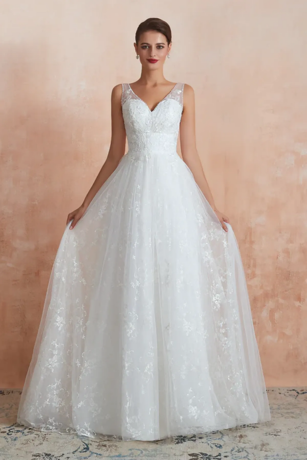 A-line wedding dress with V-neck lace bodice and flowing tulle skirt, front view