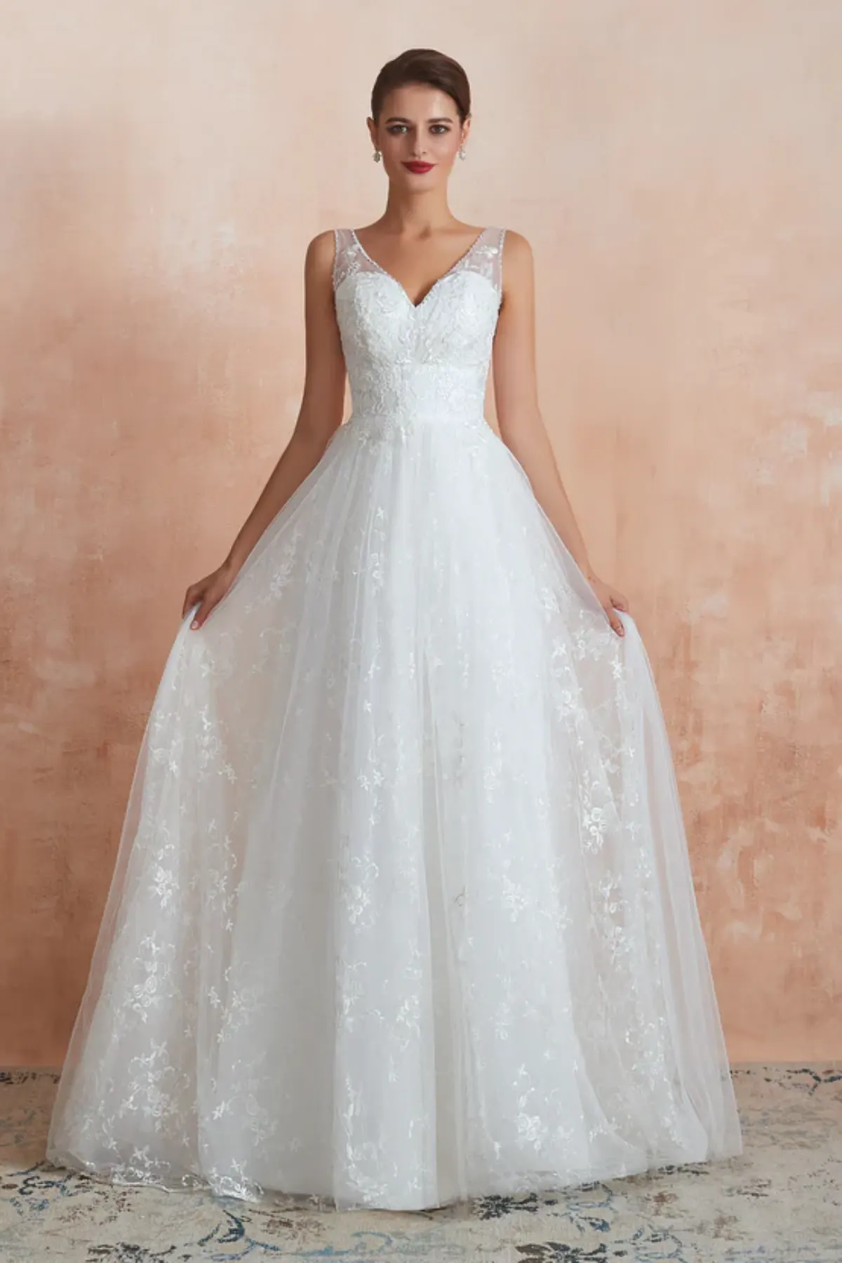 A-line wedding dress with V-neck lace bodice and flowing tulle skirt, front view