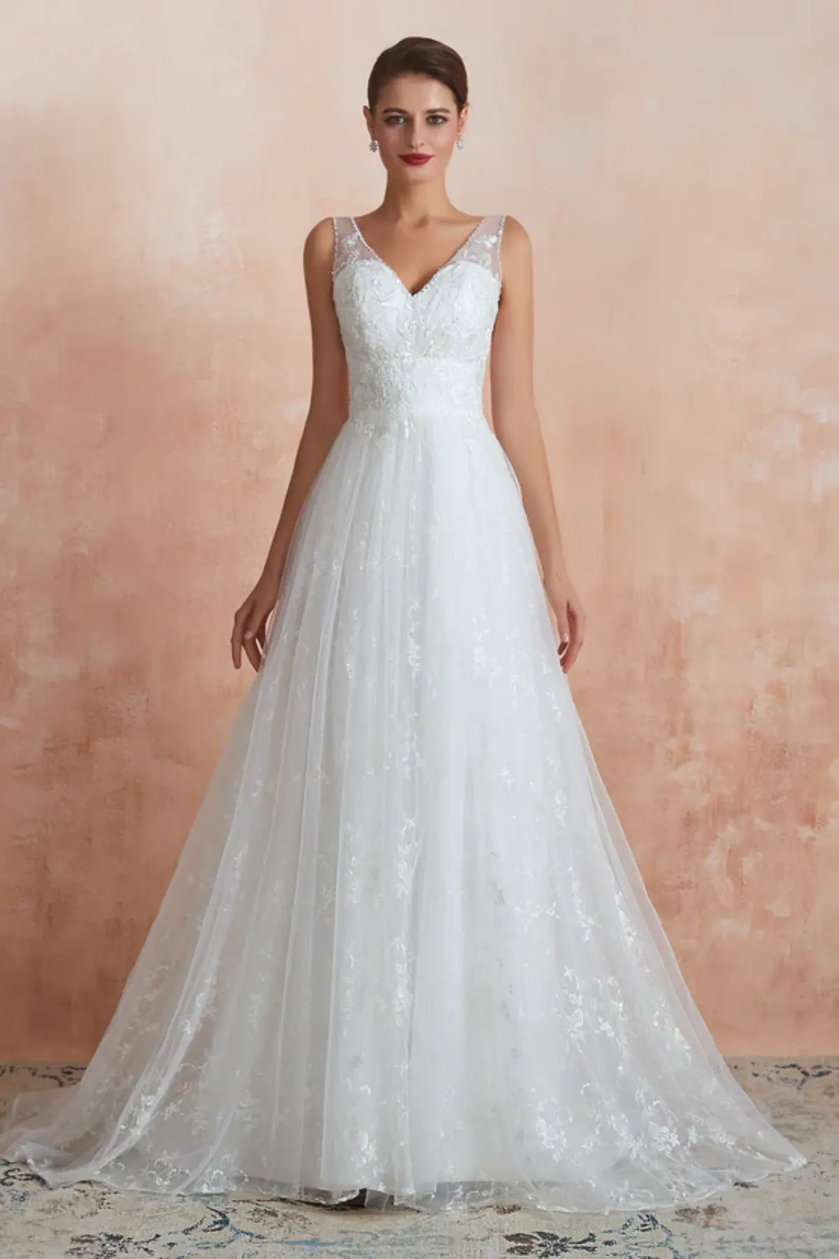 A-line wedding dress with V-neck lace bodice and flowing tulle skirt, front view