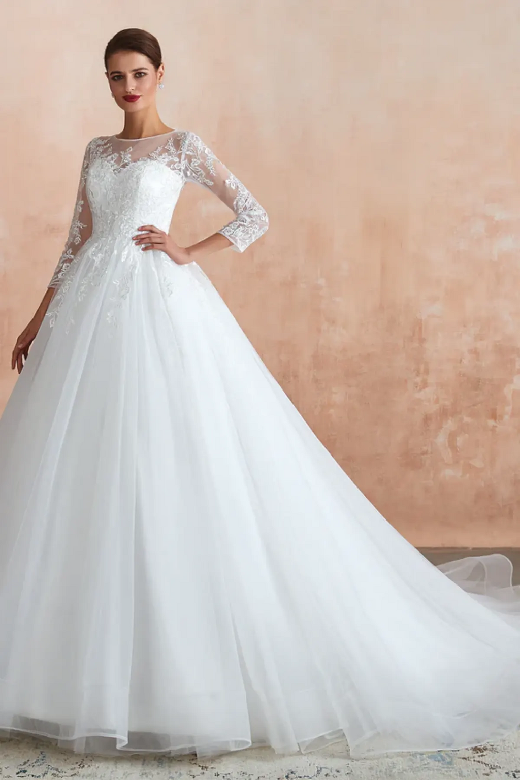 Elegant A-line bridal gown with lace long sleeves and flowing tulle skirt with train