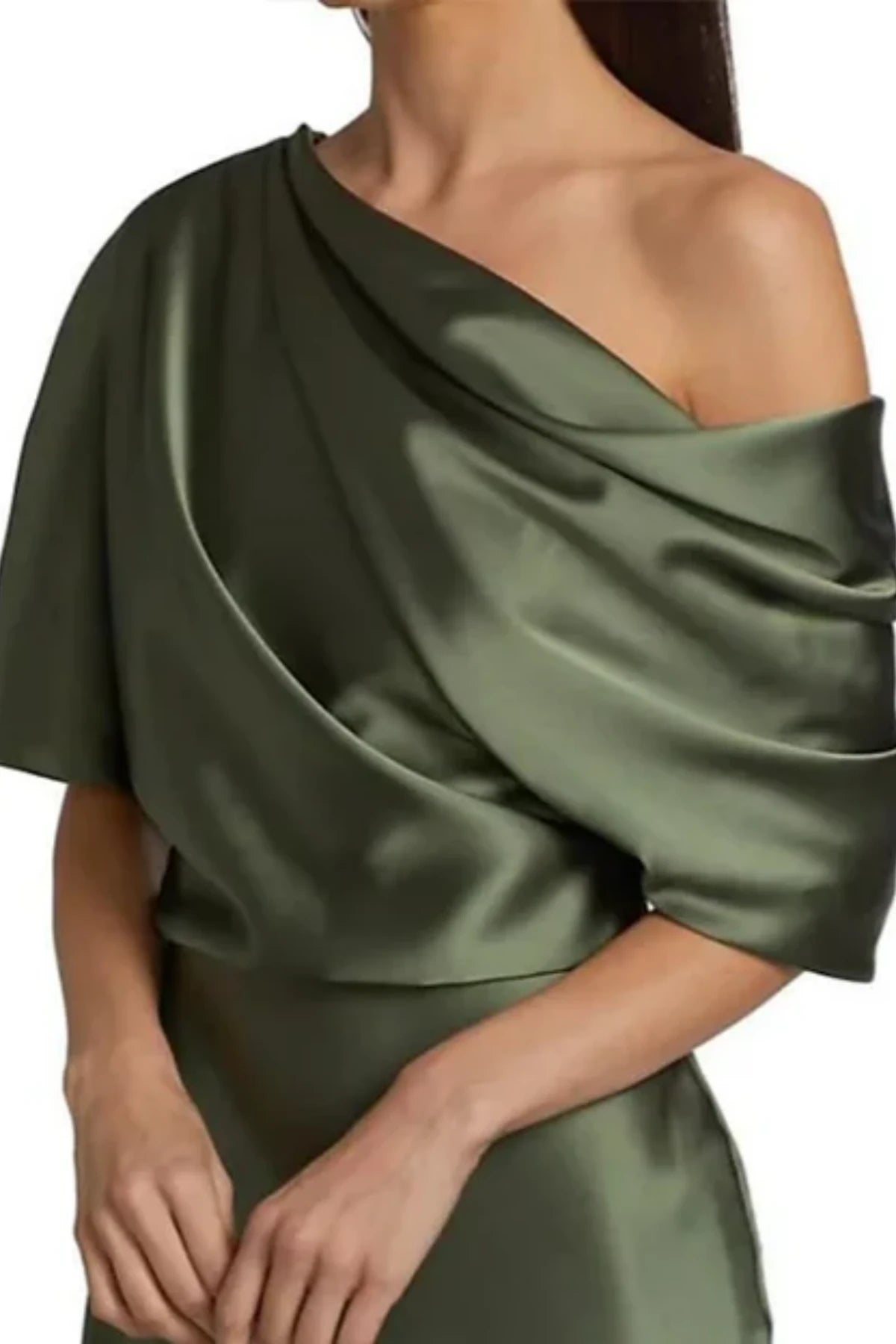 close-up of a green mother of the groom dress, highlighting the asymmetrical neckline cut and smooth tailoring over the shoulders