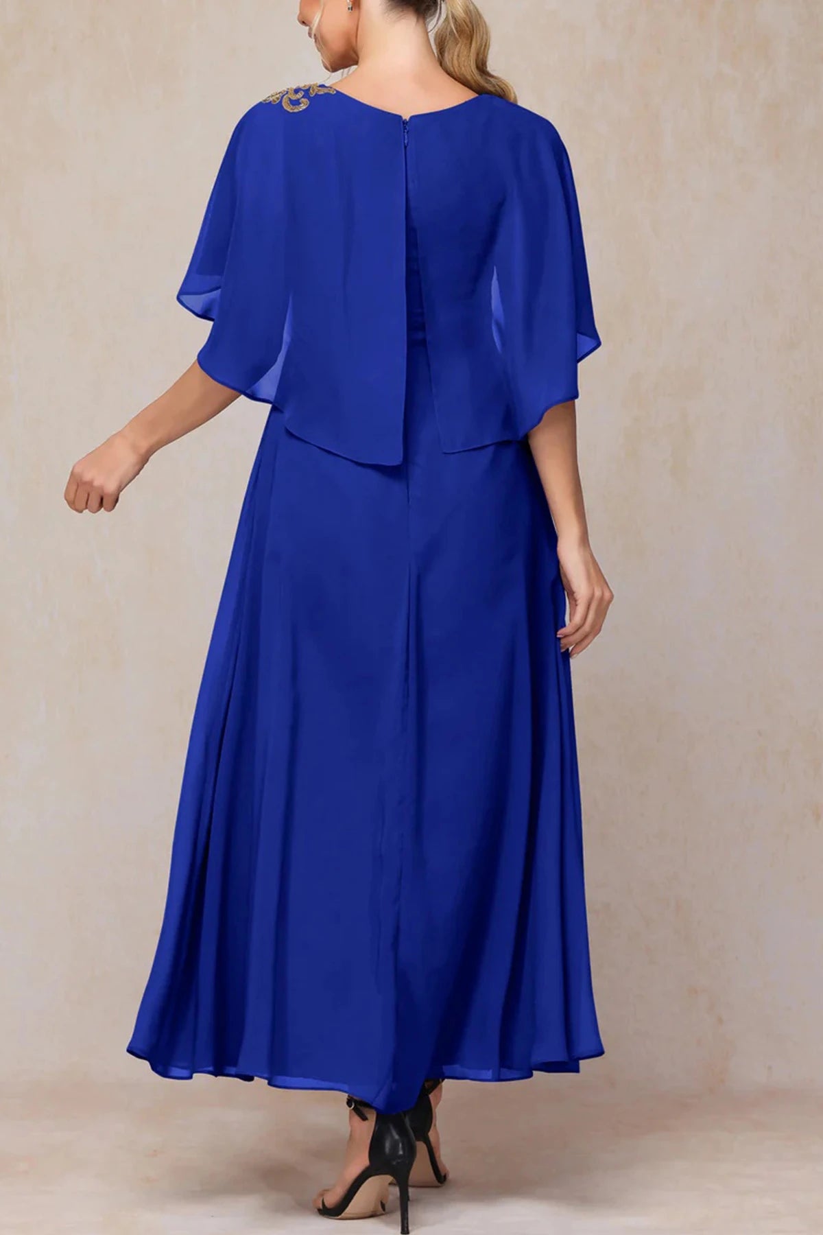 Back view of royal blue chiffon mother of the bride dress with cape sleeves
