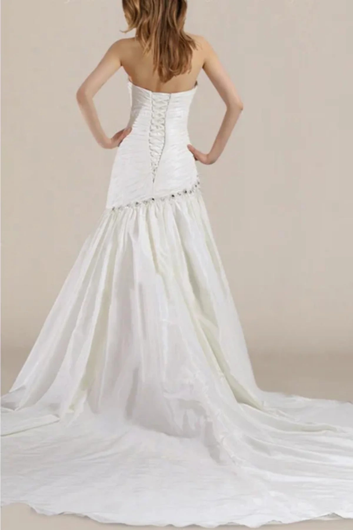 Beaded drop waist wedding dress with flowing train