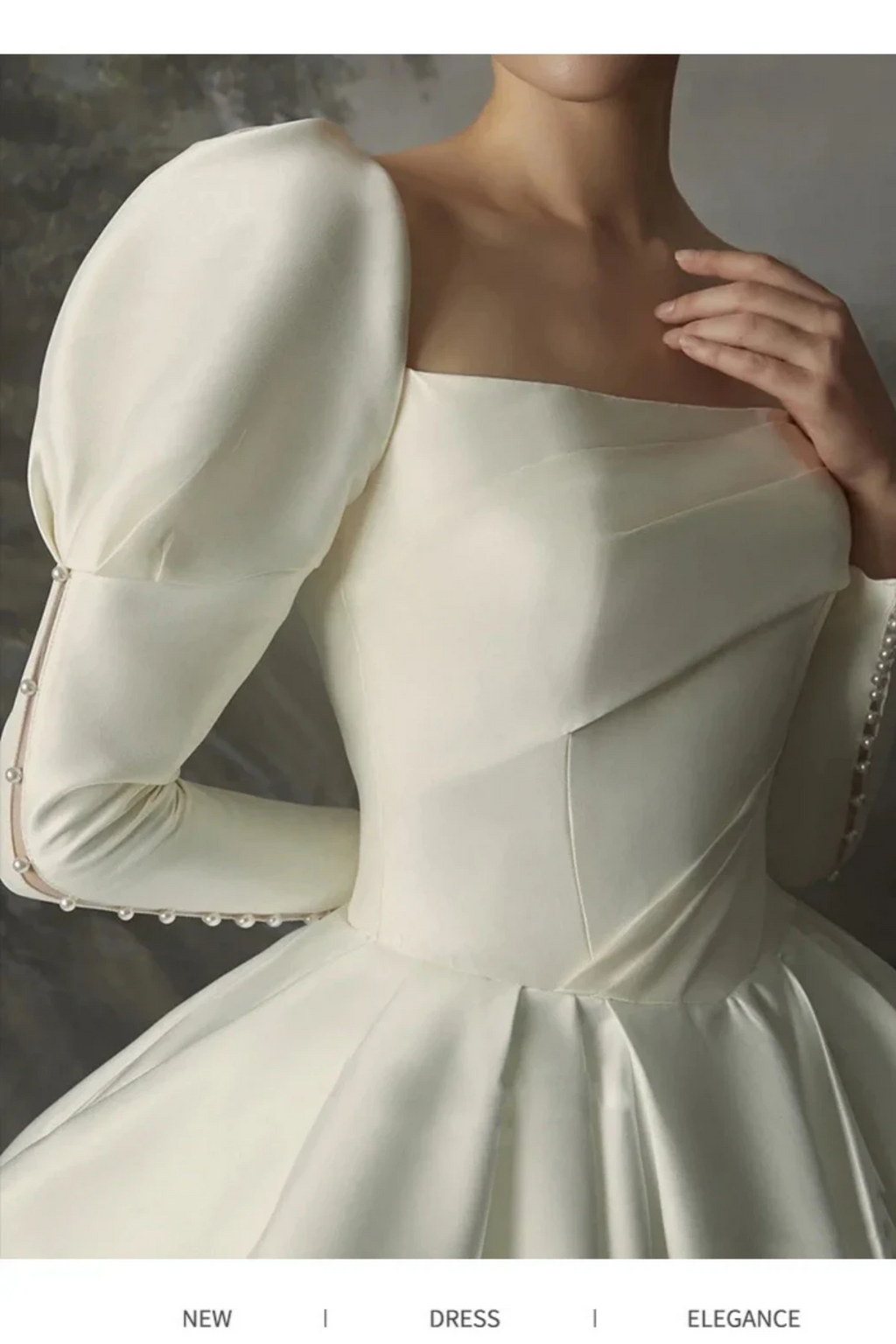 Square neckline satin wedding dress with structured corset bodice and elegant puff sleeves close-up