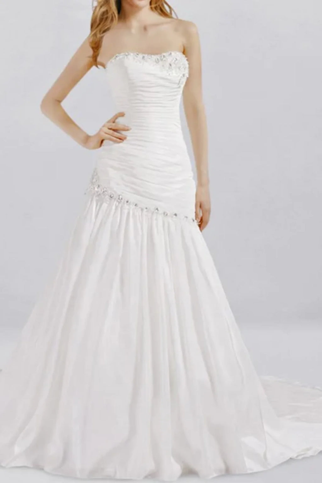 Strapless drop waist wedding dress with ruched structured bodice