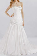 Strapless drop waist wedding dress with ruched structured bodice