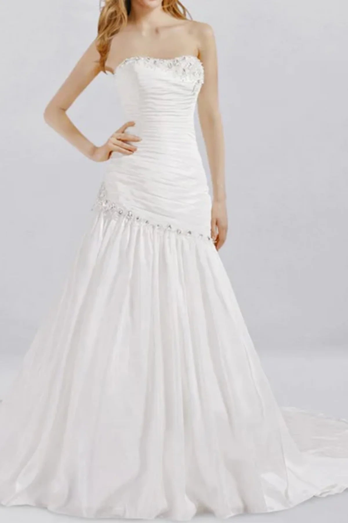 Strapless drop waist wedding dress with ruched structured bodice