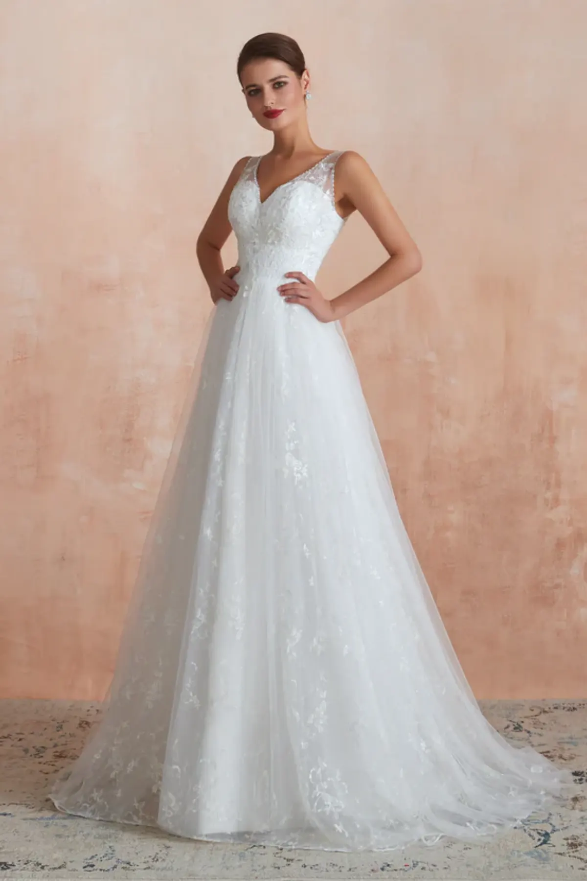 Side view of V-neck lace A-line wedding dress with lightweight tulle skirt