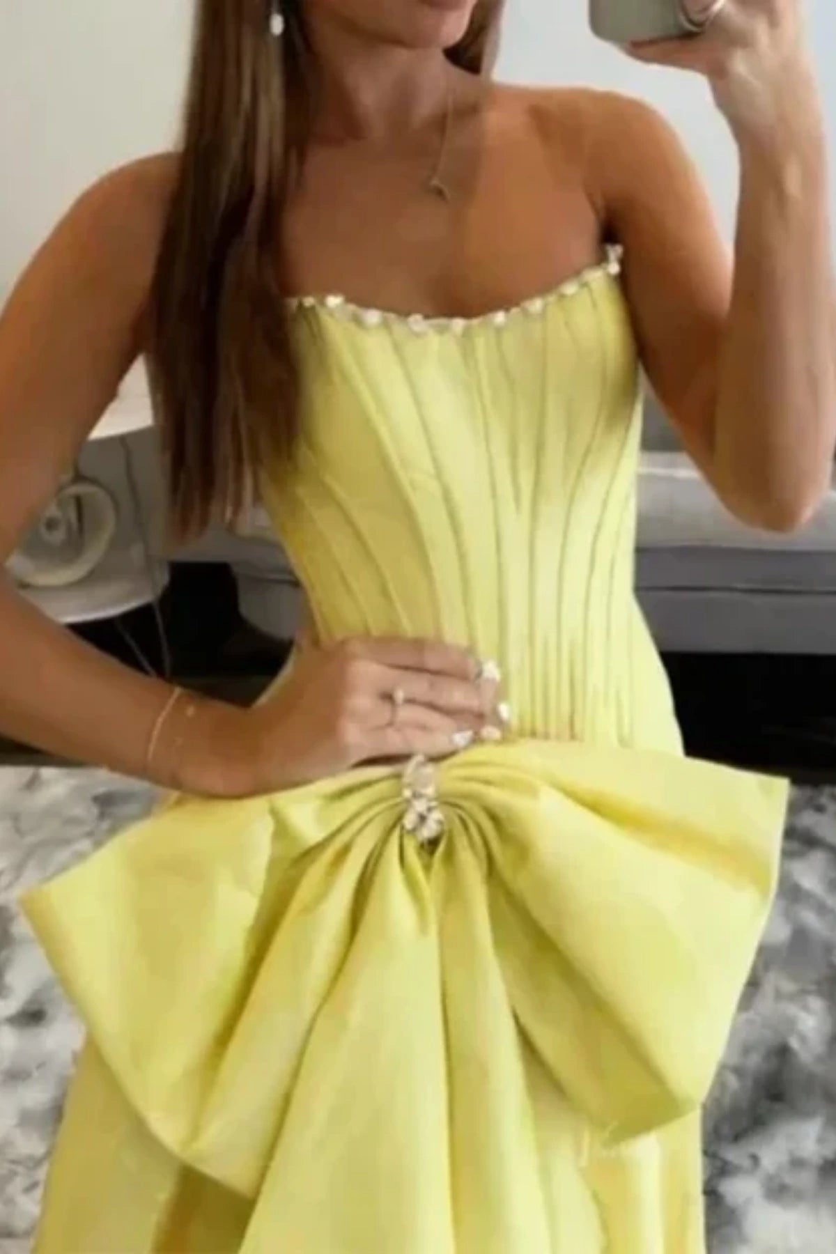 corset bodice and big bowkont of the yellow satin prom gown